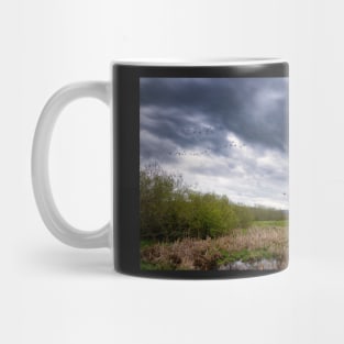 Geese Flying Off Under Stormy Skies Mug